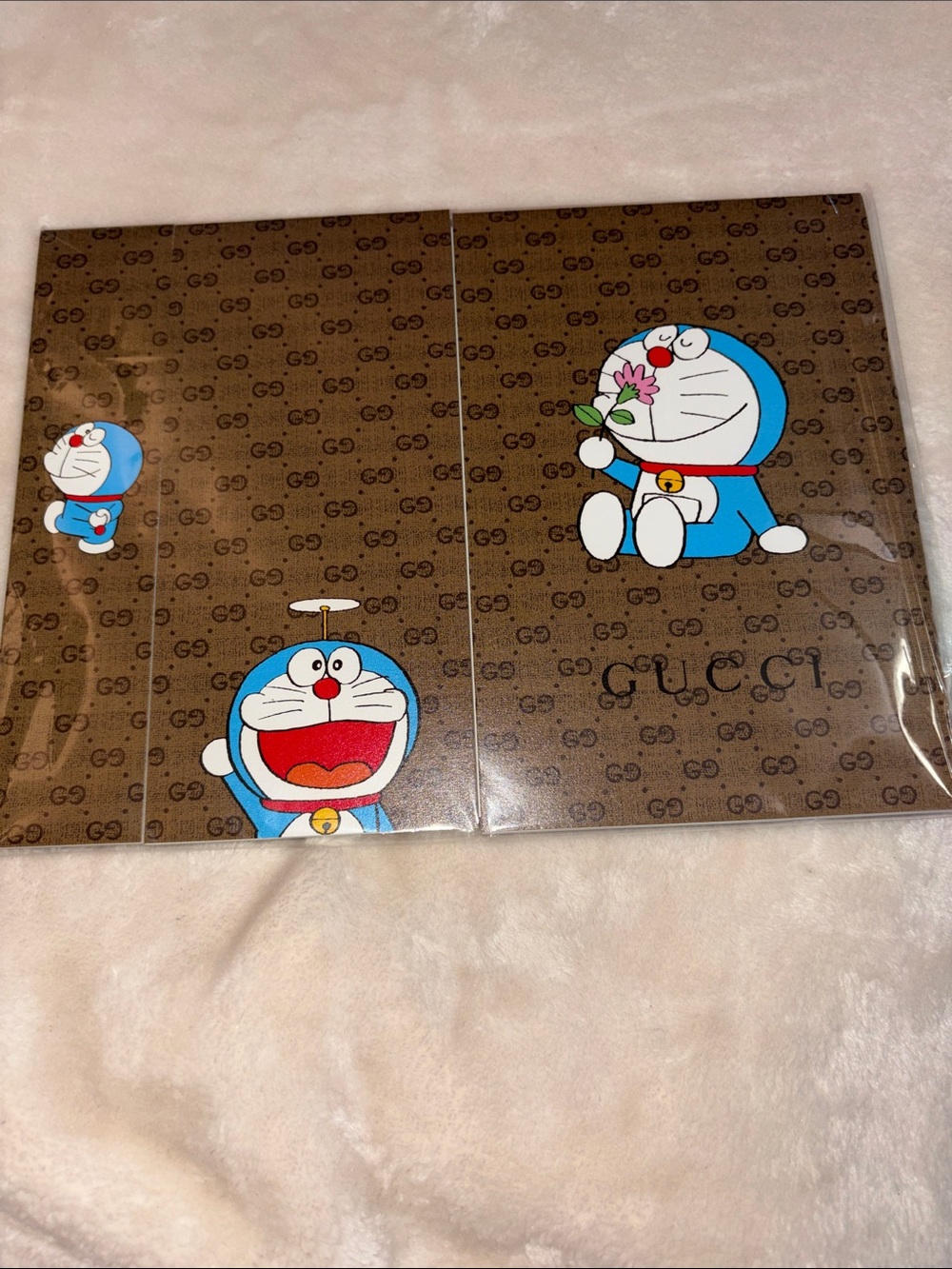 Gucci x Doraemon Brown Pattern notebook set.